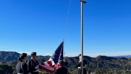 The flag is brought down at Verdugo Hills Cemetary