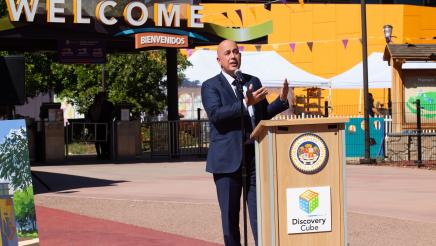 Discovery Cube Board Chair, Dr. Pedram Salimpour, speaks at check presentation.
