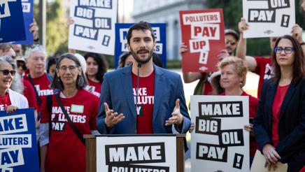 Organizers speak at Make Polluters Pay rally