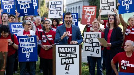 Organizers speak at Make Polluters Pay rally