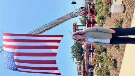 Assemblymember Laura Friedman stands under the American flag