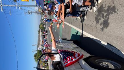 Assemblymember Laura Friedman passes out candy to parade attendees