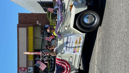 Assemblymember Laura Friedman waves at parade attendees