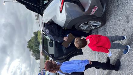 Officer helps parent install car seat